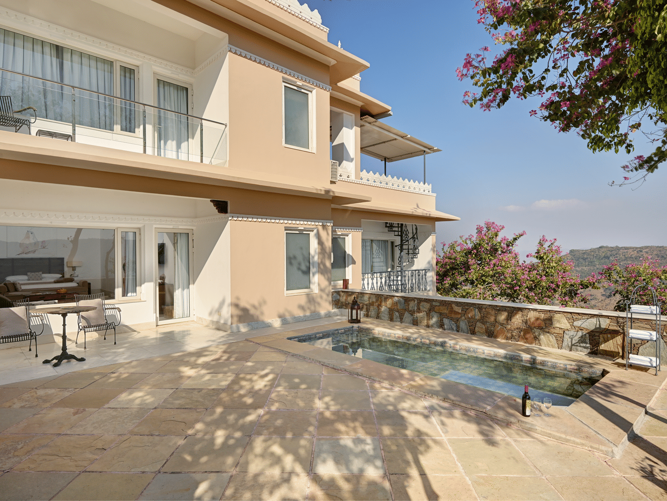 Facade of Plunge Pool Suite in Fateh Safari Suites featuring two storey building and a small pool in the ground floor.