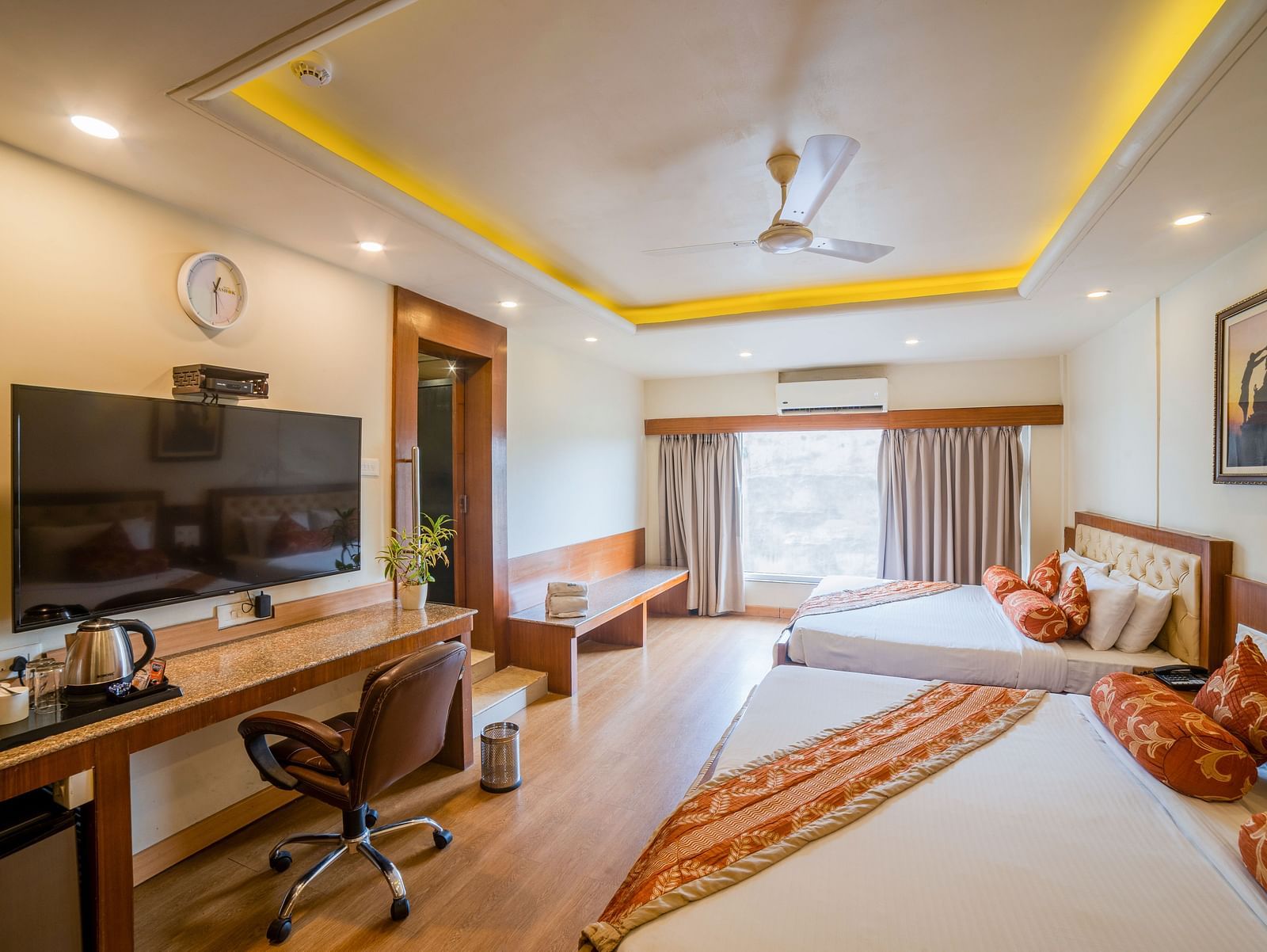 Family Room featuring two lare beds with interior decor. - Hotel Ashok Nagpur