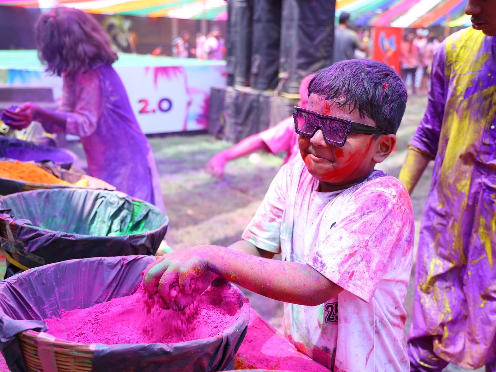 Children are playing with colourful powders during a Holi celebration | Vedic Village Spa Resort, Kolkata