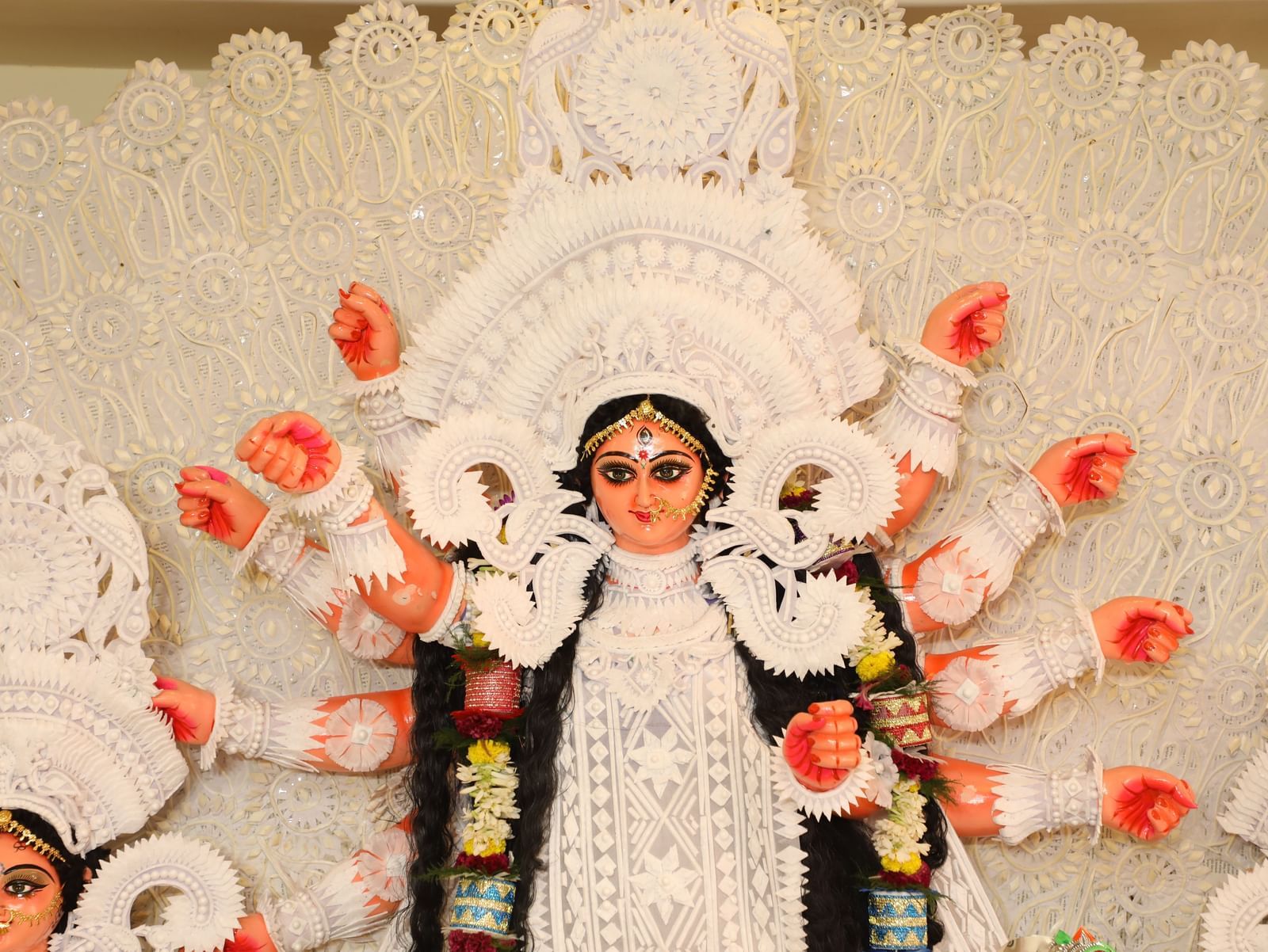 A close-up of a decorated idol of the Hindu goddess Durga during a festival | Vedic Village Spa Resort, Kolkata