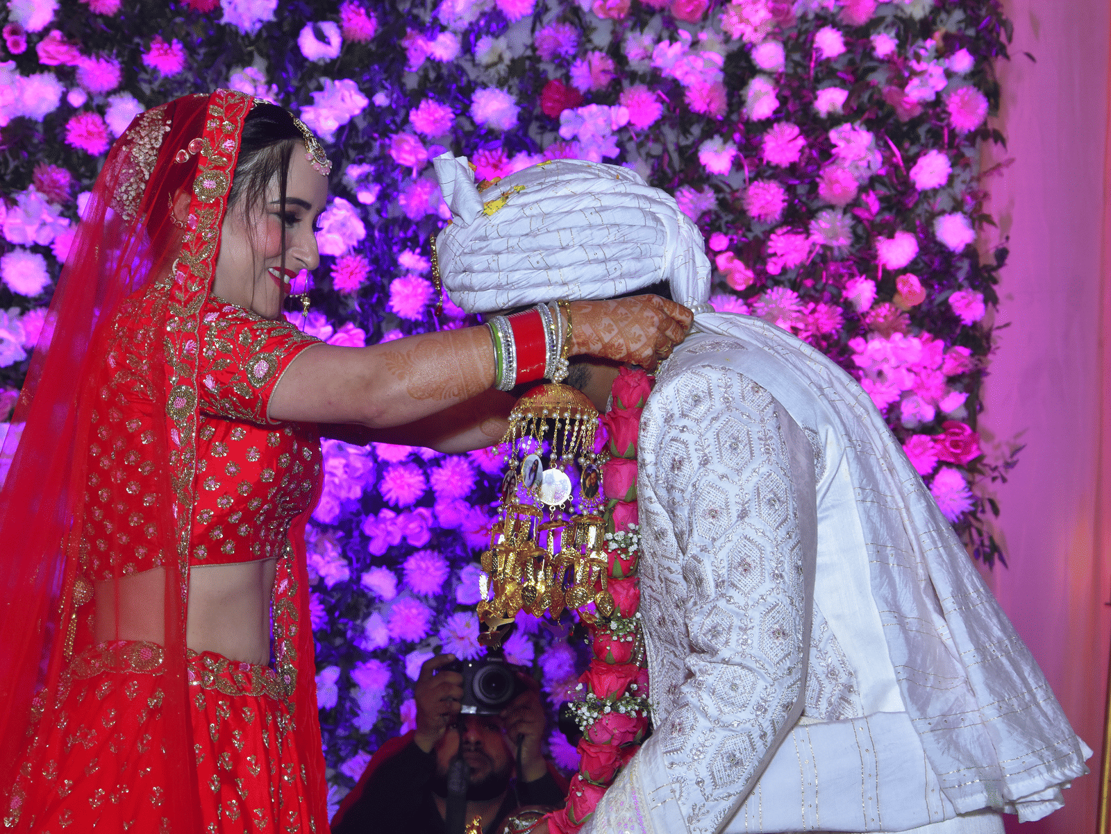 Bride and groom exchange garlands during a traditional ceremony at Vedikant Resorts The Mallard Corbett.