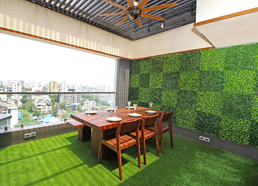wooden dining table and chairs with picturesque views of the city