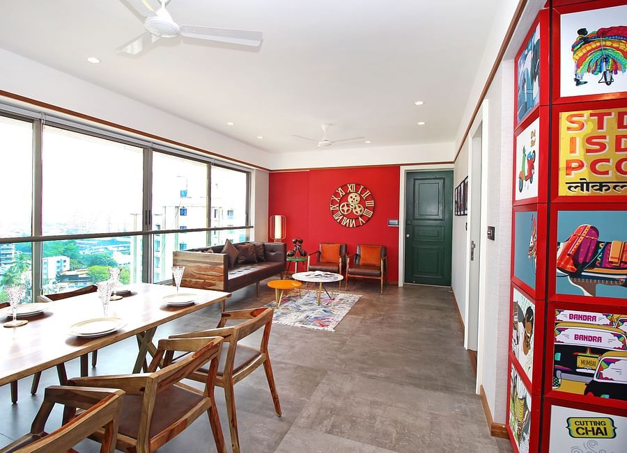 An image of a living room with fancy interiors, cushy sofas and expansive windows overlooking the city at Theory9 - Premium Serviced Apts, Khar