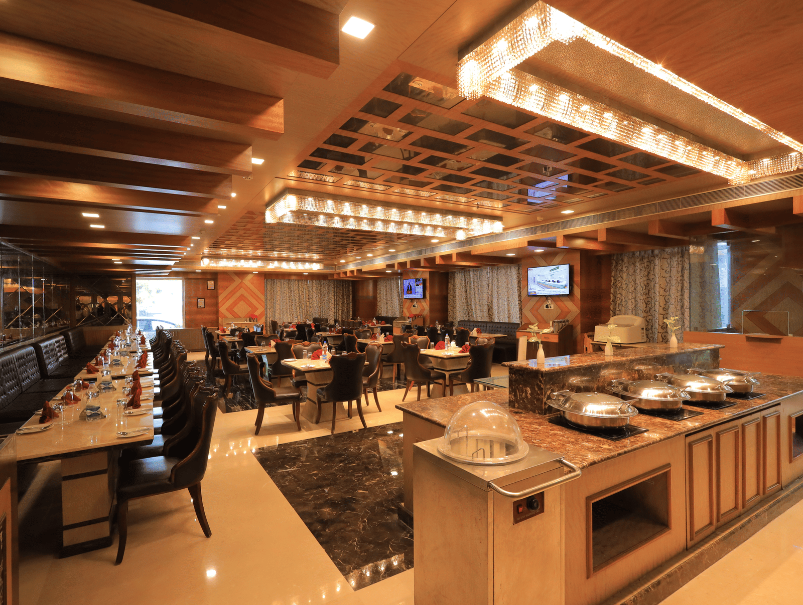 Corner-view shot of the Porchae restaurant featuring a buffet counter overlooking the elegant dining area.