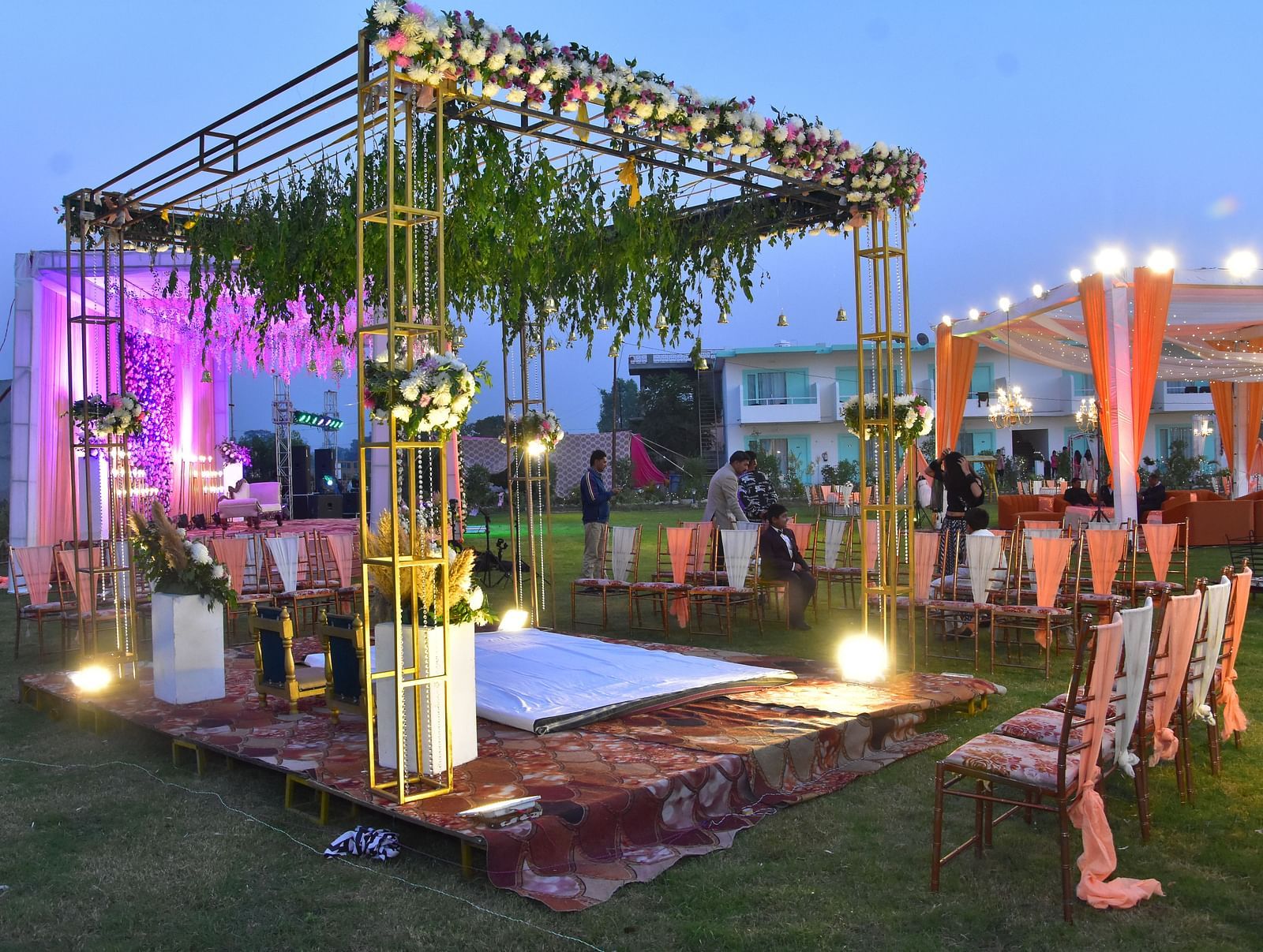 Evening wedding lawn decor with floral lights and canopy at Vedikant Resorts The Mallard Corbett.