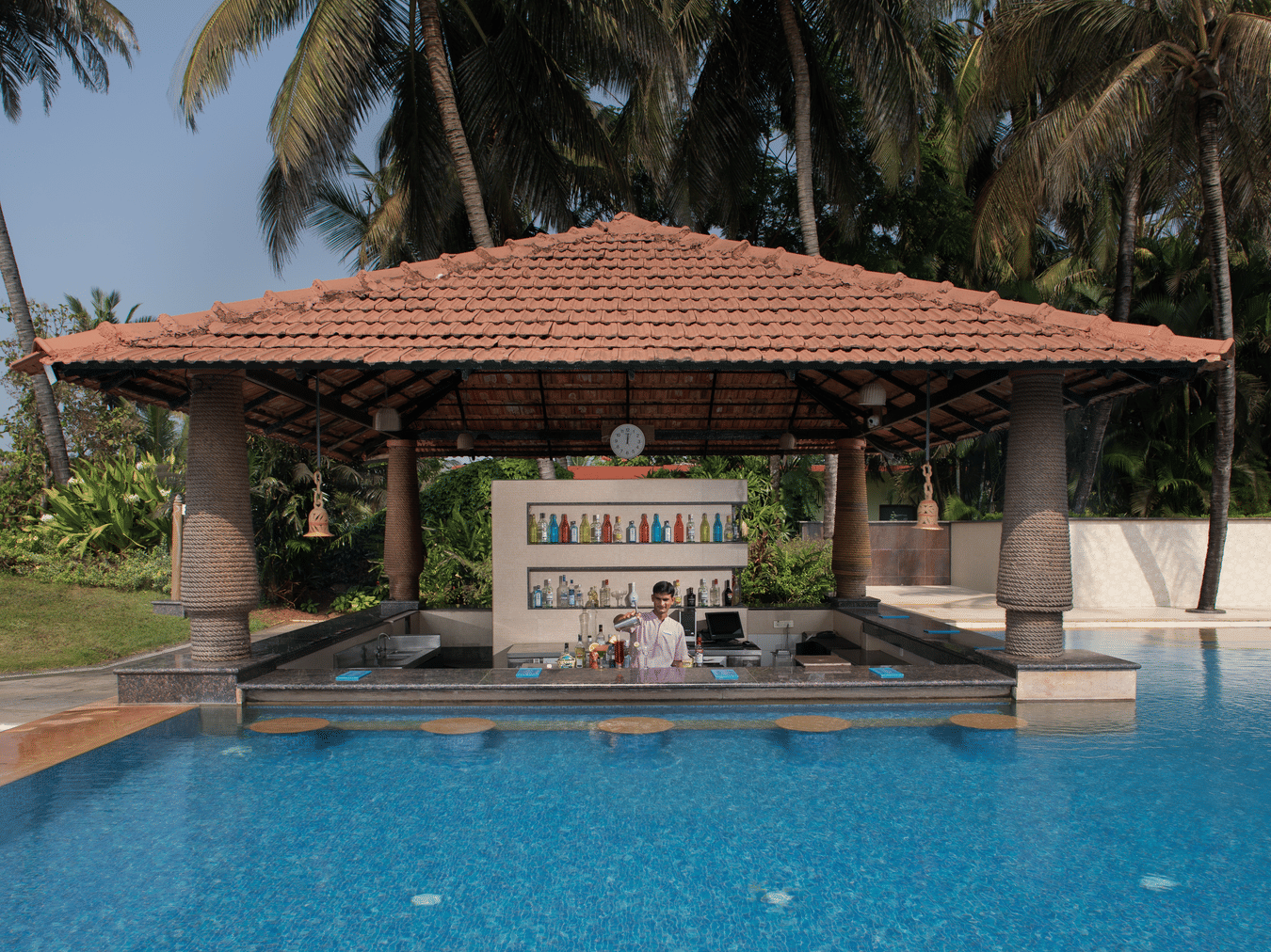 Aquarius, a pool-side cafe in South Goa, looks dream-like as it resembles a gazebo coming out of the pool in a lush green backdrop