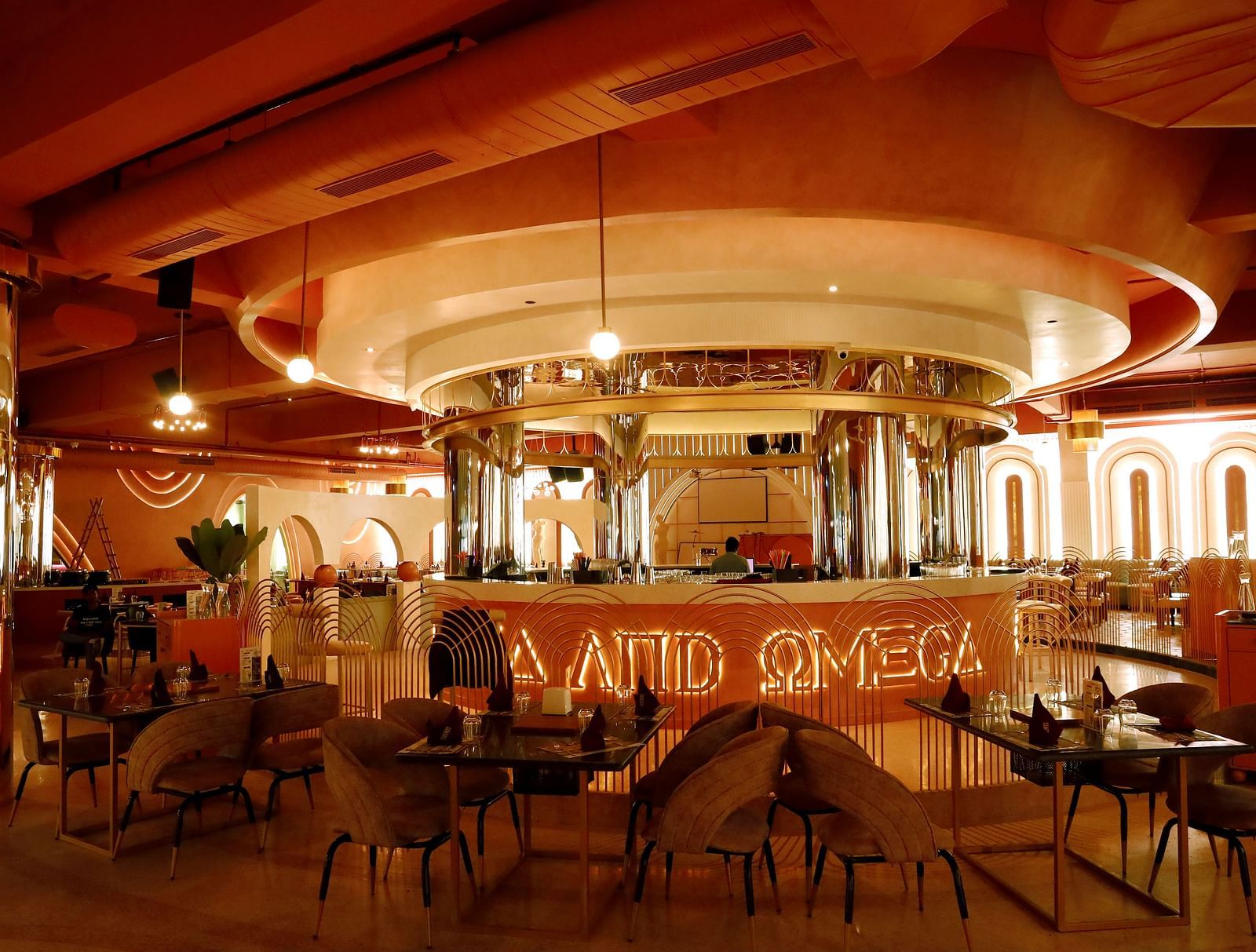 An image of a restaurant featuring a counter, and tables and chairs set at Themis Barbecue House, Ambala