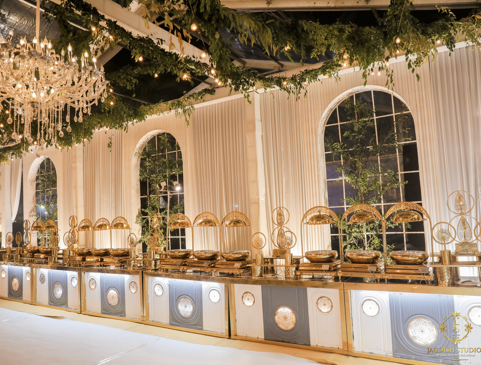 Luxuriously decorated buffet setup with chandeliers and elegant interiors at one of the premium function halls in Agra | Hotel Clarks Shiraz, Agra