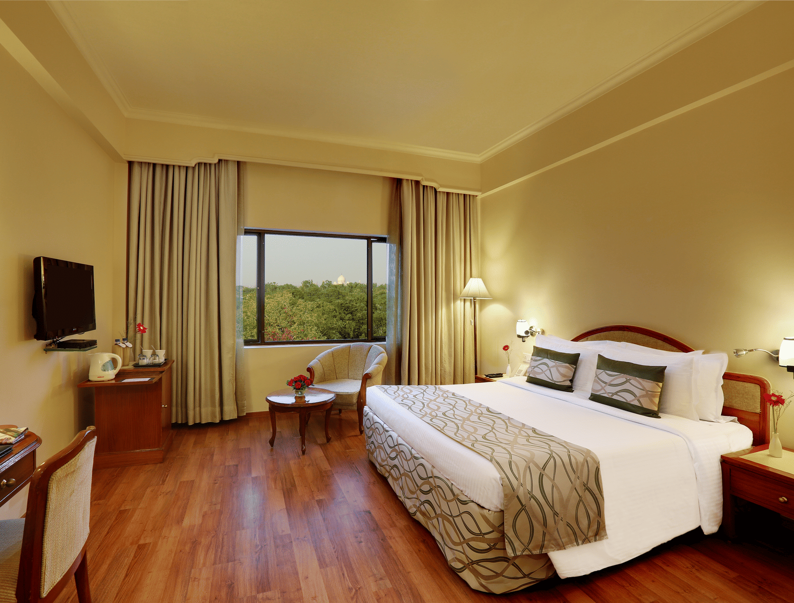 Superior Room at Hotel Clarks Shiraz, Agra with a double bed and a television