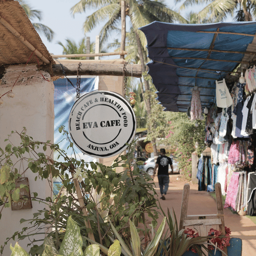 A charming Goan cafe and souvenir shop featuring local handicrafts, colourful clothing, and unique gift items.