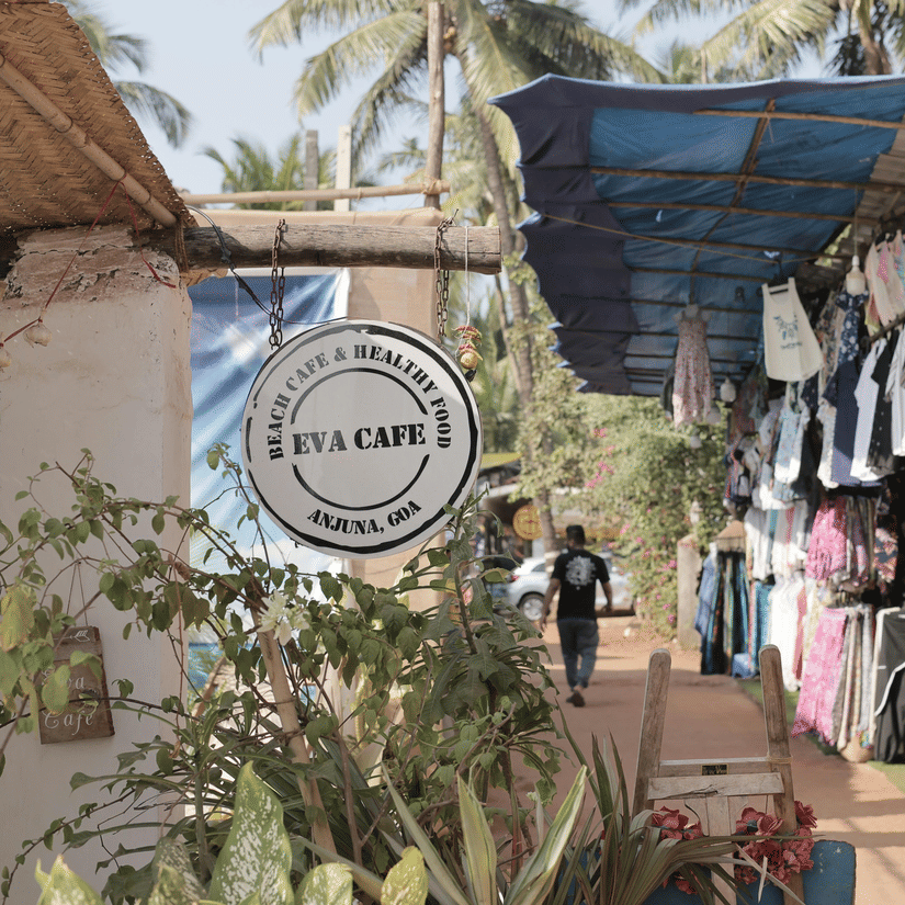 A charming Goan cafe and souvenir shop featuring local handicrafts, colourful clothing, and unique gift items.