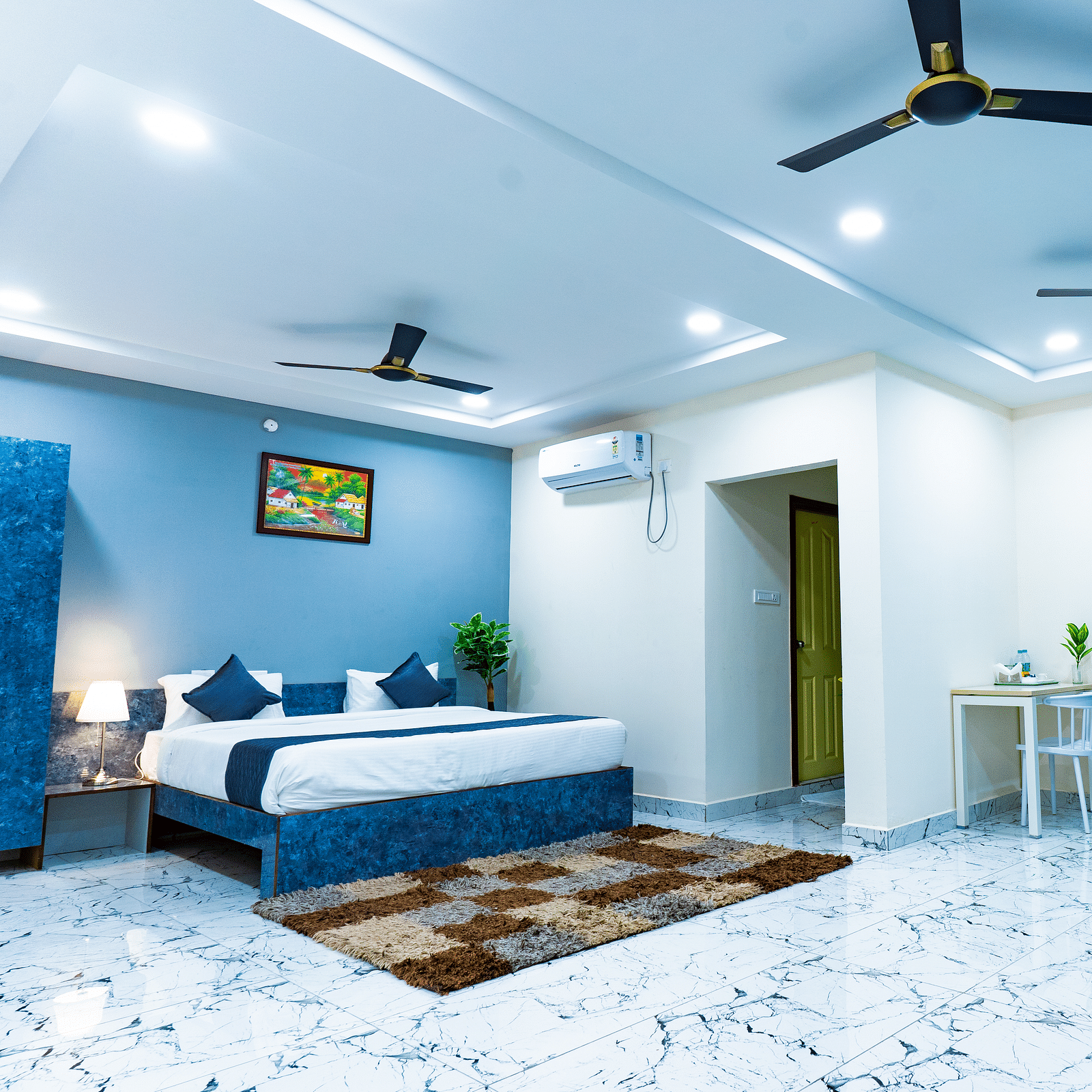 An image of a Suite with sitting area, a king size, AC, fan, etc. Hotel Aerotel, Hyderabad - A Unit of Comfort Hometel