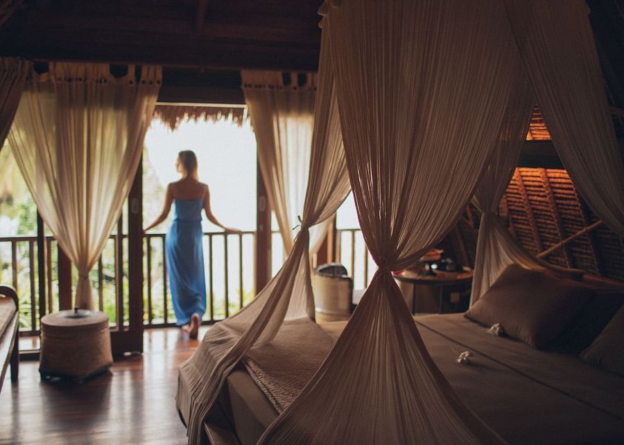 alt-text woman looking outside the balcony