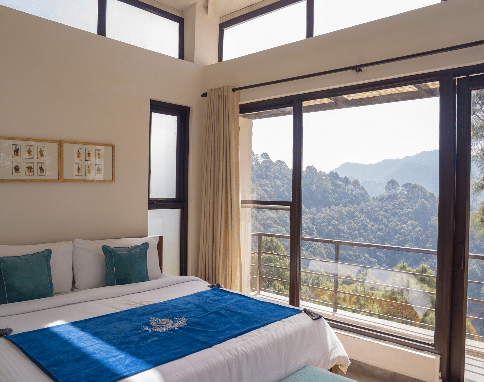 A  bedroom with pillows and a balcony at BluSalzz Escapade Resort, Lansdowne