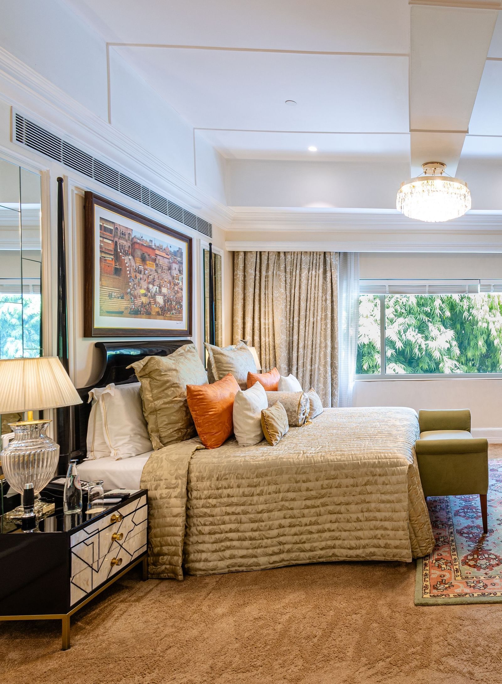 image of the willingdon crescent suite with plush bedding and a wall mounted television placed opposite to it  - The Claridges New Delhi