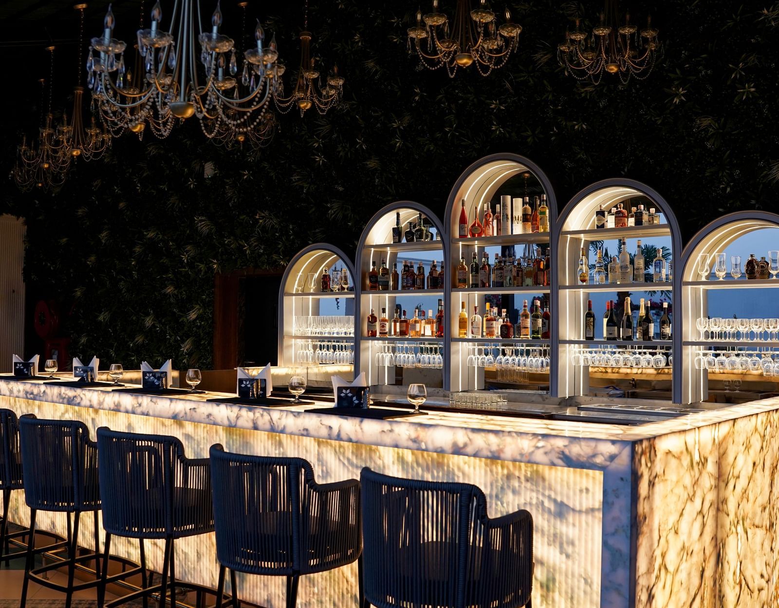Corner view shot of the bar counter featuring an extensive collection of premium liquor for display at the Sky Roof at M2 Square by Monday Premium.