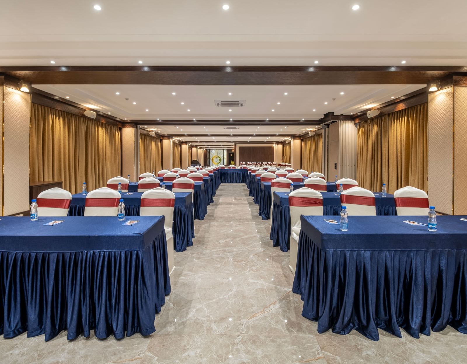 Spacious hall at Monday Hotels Amalapuram Heights with classroom seating arrangement.