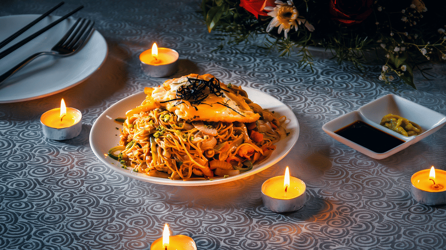 Stir-fried noodles with vegetables topped with a fried egg and shredded seaweed, served with soy sauce and wasabi at Ajito, Ilara Hotels & Spa, Tada.