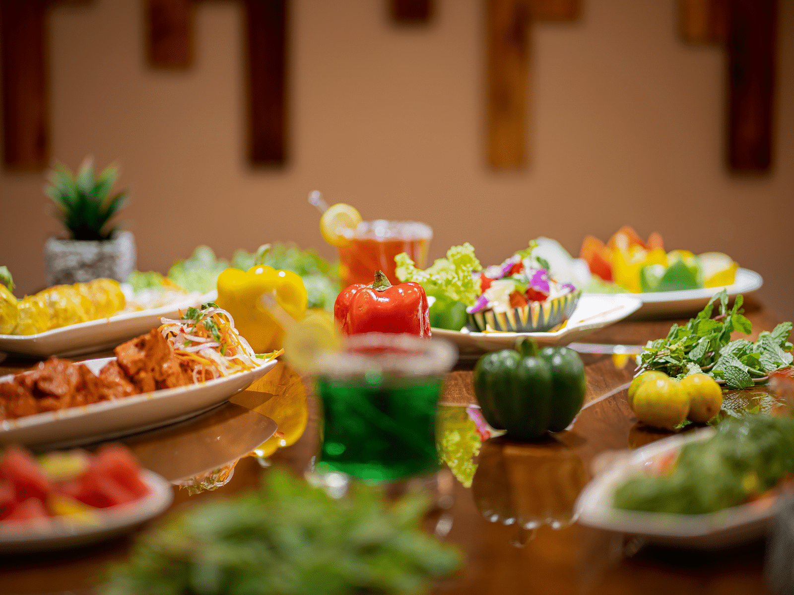Green, yellow and red food items on a table - Coral Reef Hotel & Spa, Port Blair