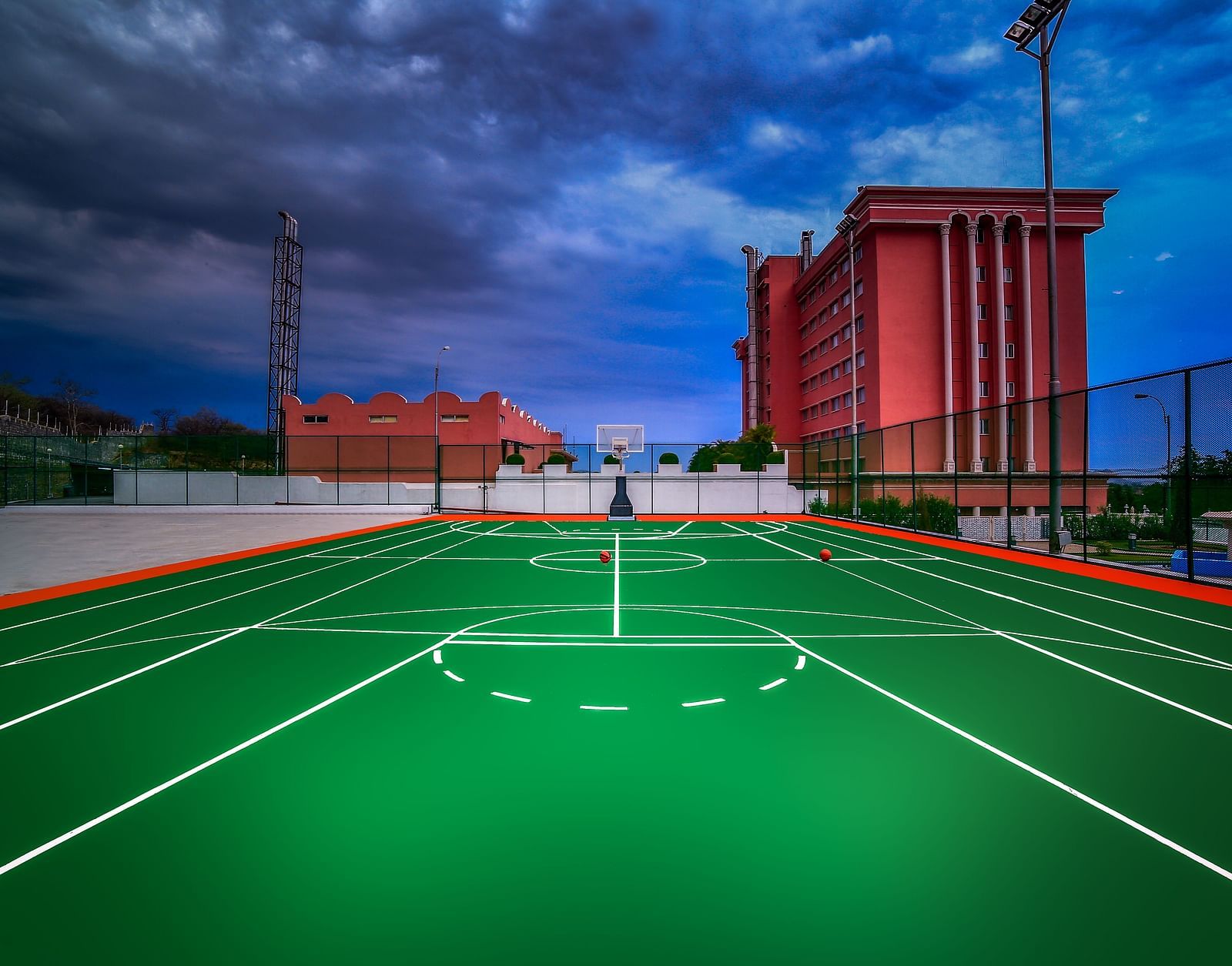 A shot the basketball court during dusk at Tara, Comfort Hotel in Hyderabad - Ramoji Film City.