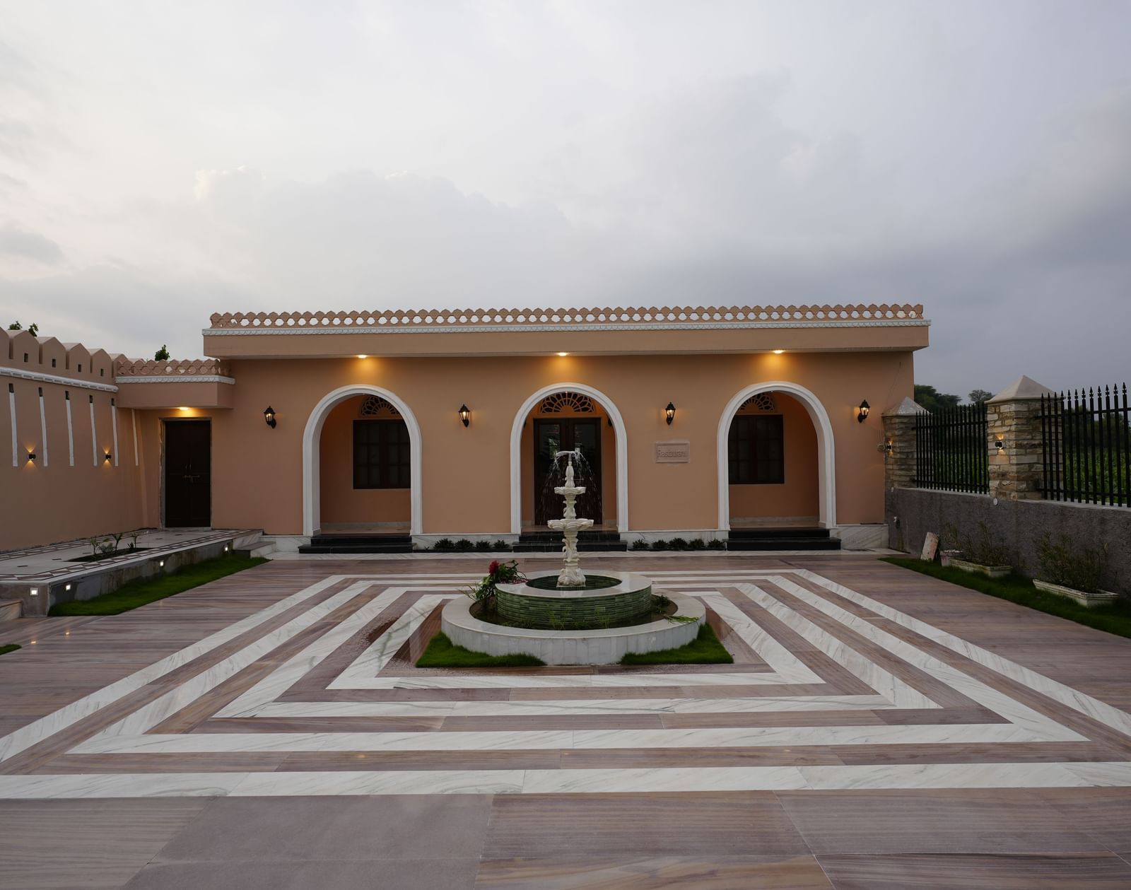 An eye-level, straight-on shot of the entrance to a building with a large courtyard at Mahendra Niwas.
