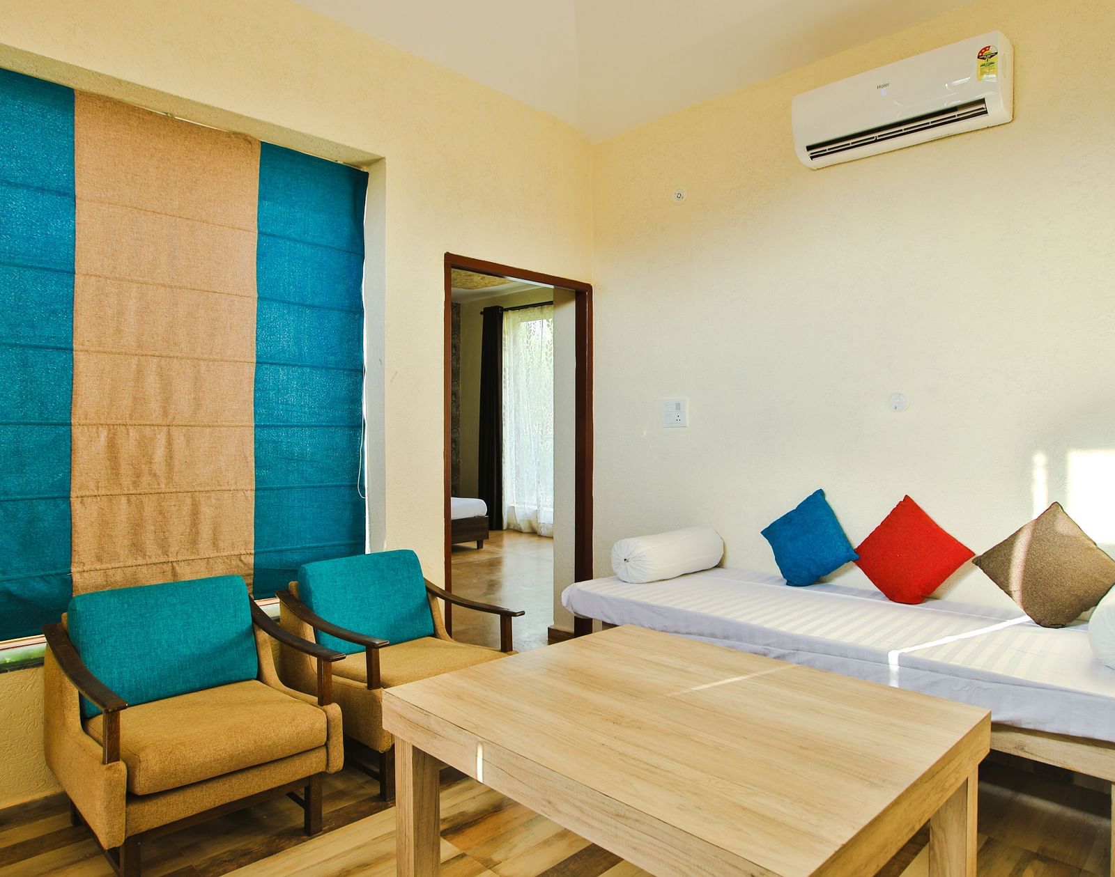 A seating area with sofas and a wooden table in front at Valley by Grassfield.