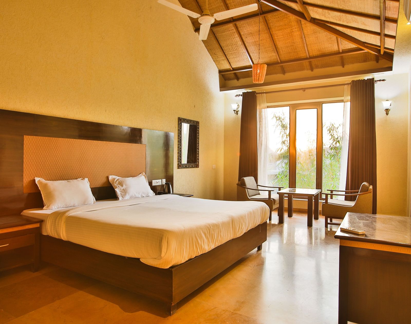 Side view of a room with a bed and wooden ceilings at Valley by Grassfield.