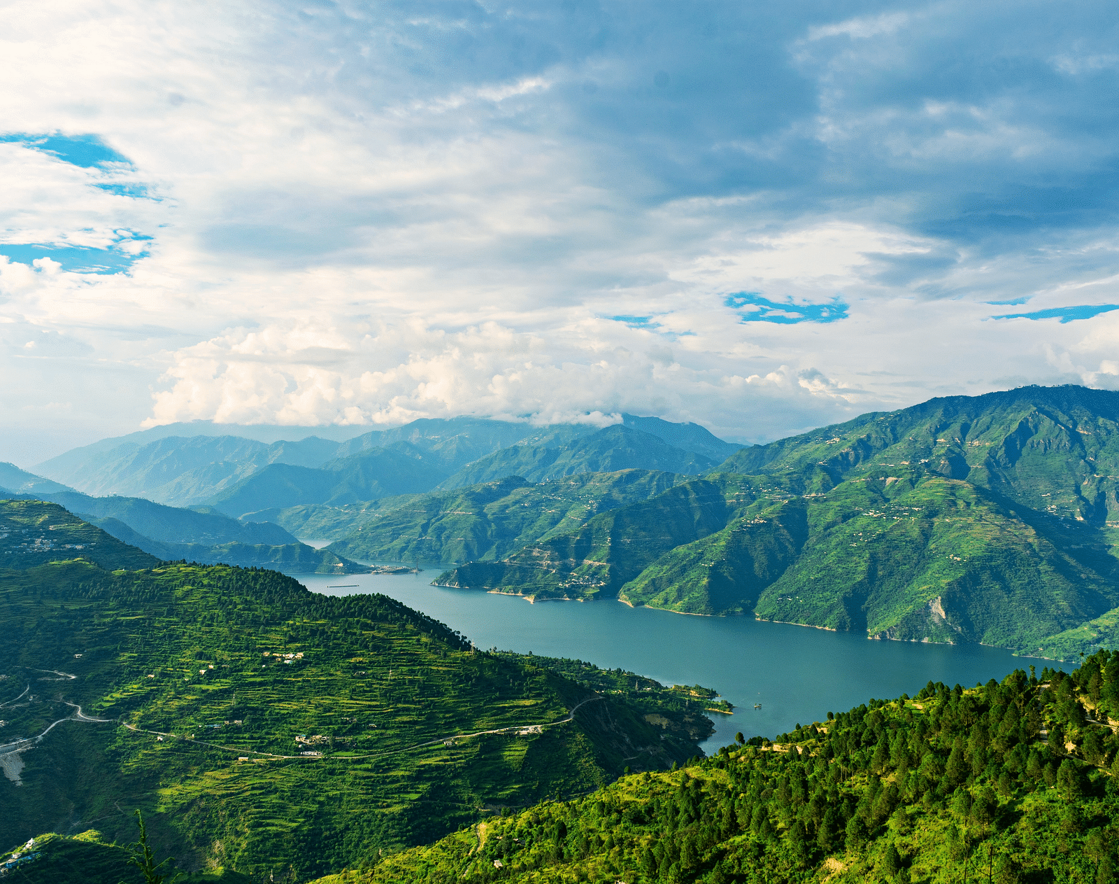 Picture featuring panoramic view of a Lake and mountains.
