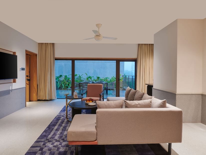 A sitting area with a sofa and a tv at The Dukes Retreat.