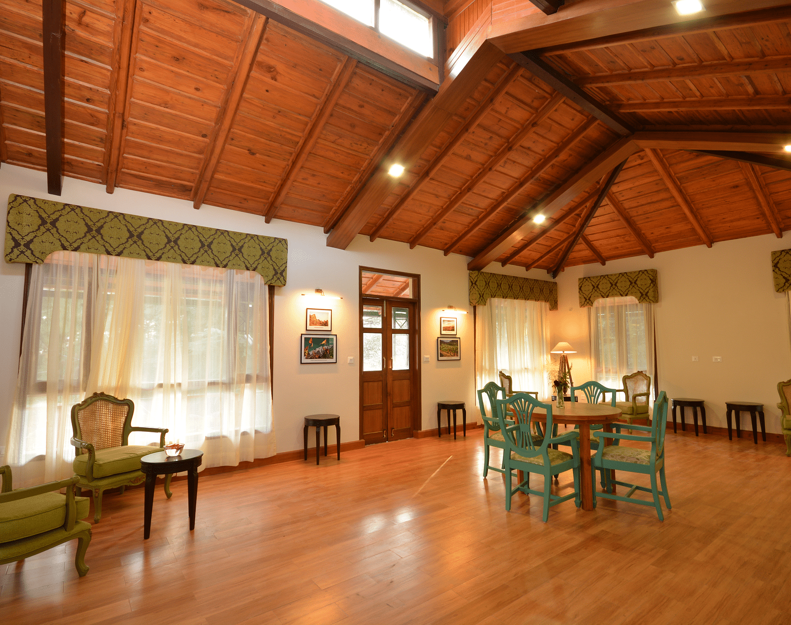 A spacious conference room in Almora with elegant wooden interiors and comfortable seating - BluSalzz Escapade - Anant Rasa Resort