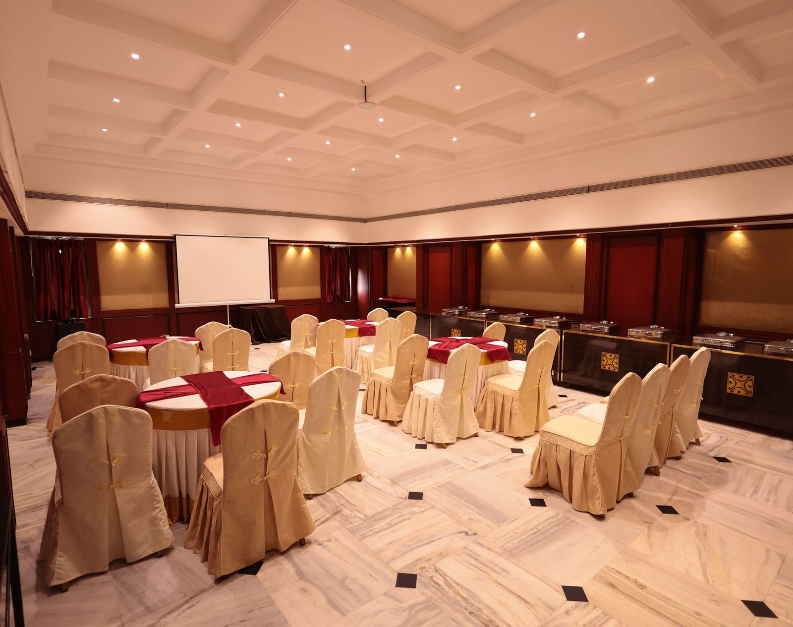 A banquet hall view from behind, with decorated tables and chairs | Cenneys Gateway