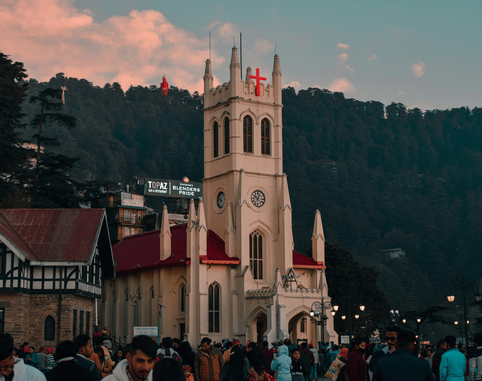 Christ Church in Shimla at dusk with surrounding hillscape.