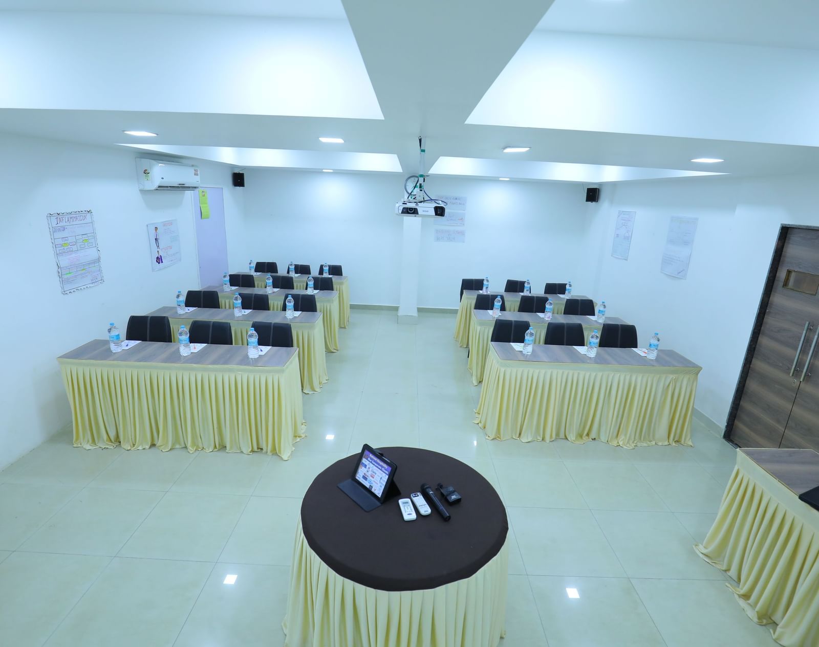 Classroom seating arrangement, projector, air-conditioning in the spacious Olive banquet hall, with ample lighting, at Highland Resort.