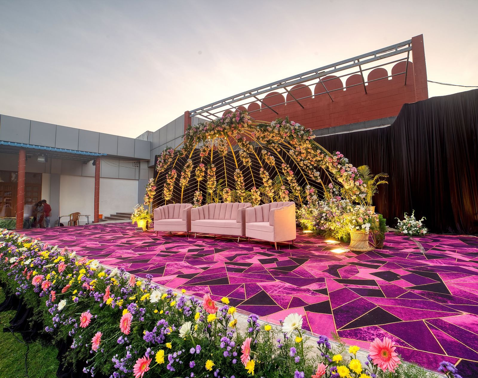 Floral-themed outdoor stage setup ideal for weddings and ceremonies at Kailash Conventions ECR.
