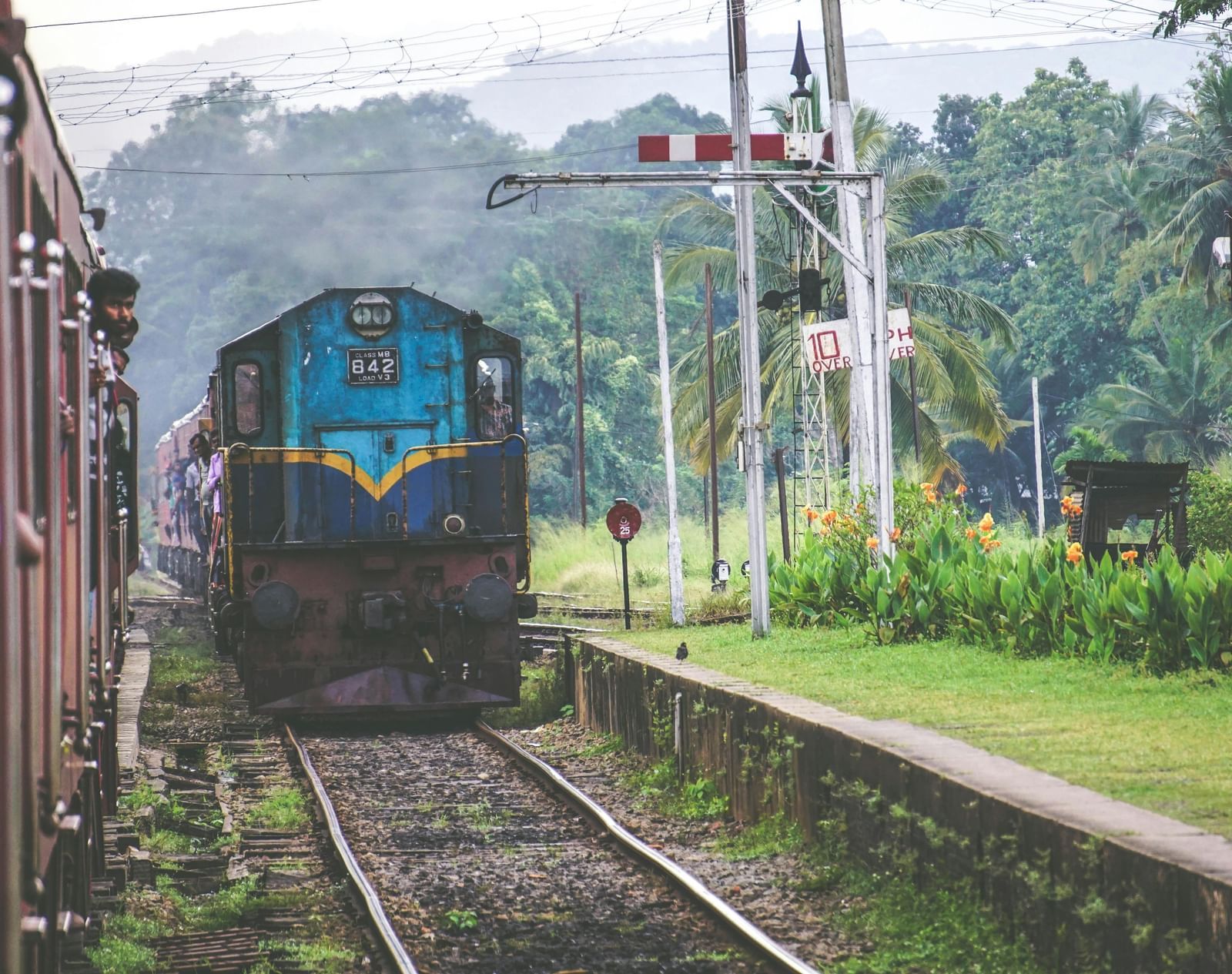 Image of two trains passing by each other on the railway tracks.