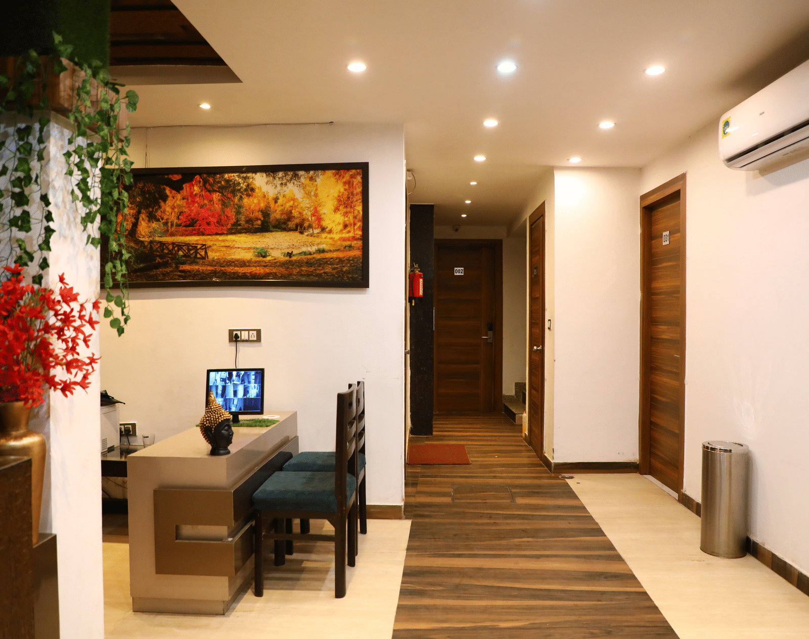 Hotel hallway or common area with a desk, lighting, and modern decor - Perfectstayz Premium at Har Ki Pauri Road (Ganga Heights)