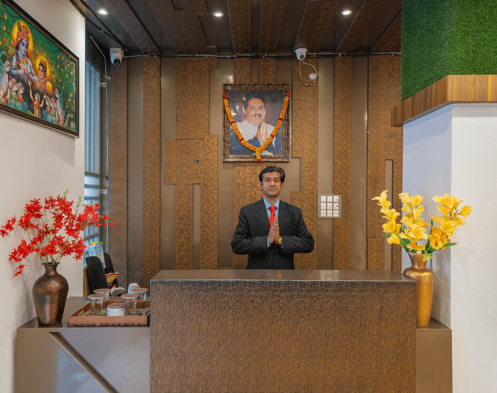 Hotel Reception Desk with an attendant standing behind it - Perfectstayz Premium at Har Ki Pauri Road (Ganga Heights)