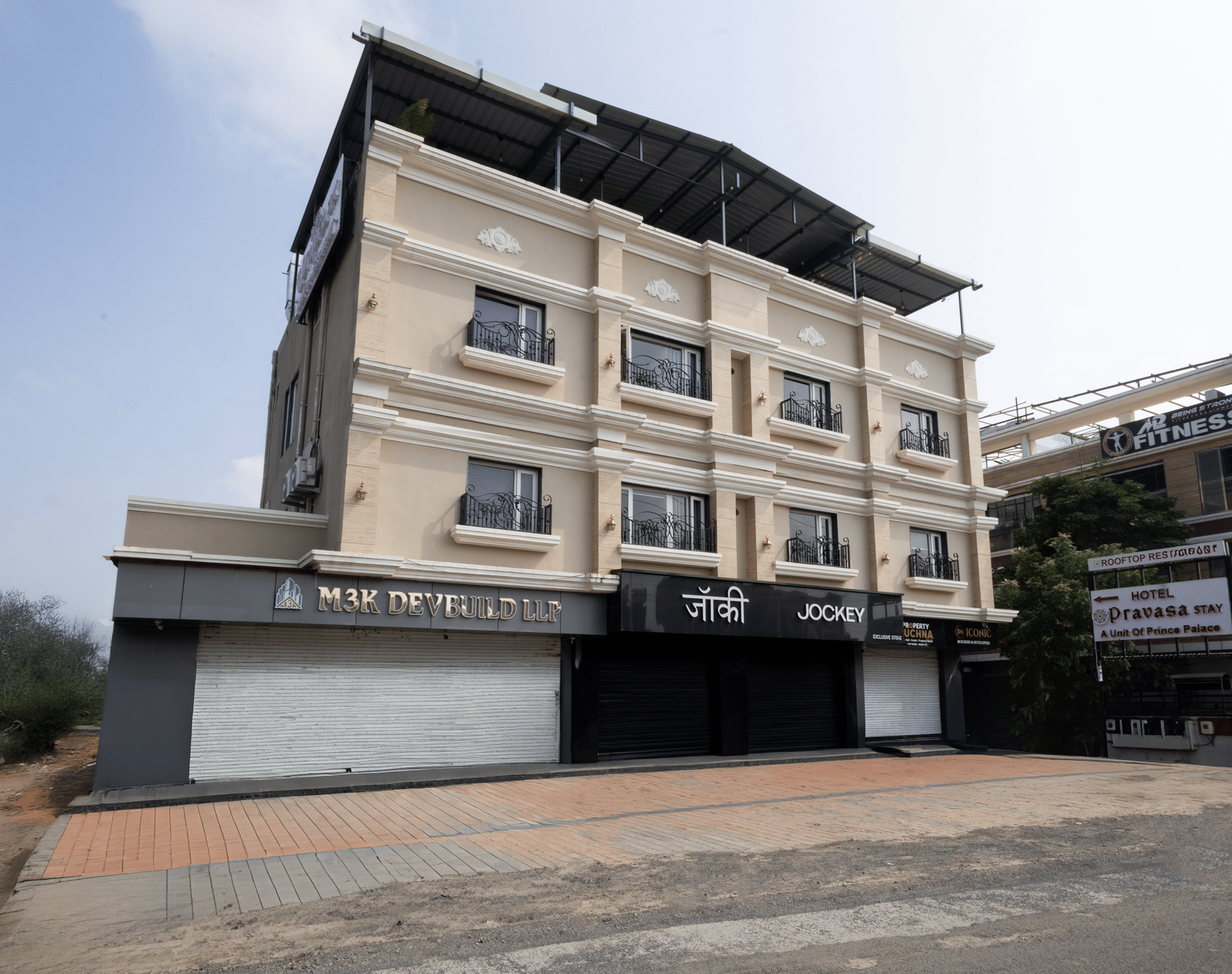 Exterior full view of the three-story building of Pravasa Stay Luv Kush, Indore.