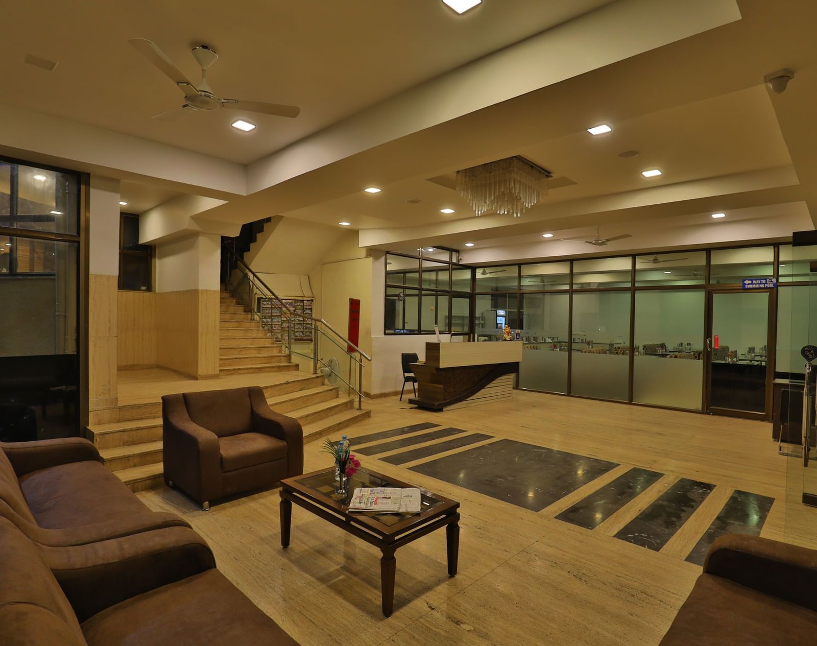 A hotel lobby and lounge area with stylish seating, wooden accents, and contemporary lighting - Retreat Heritage, Lonavala