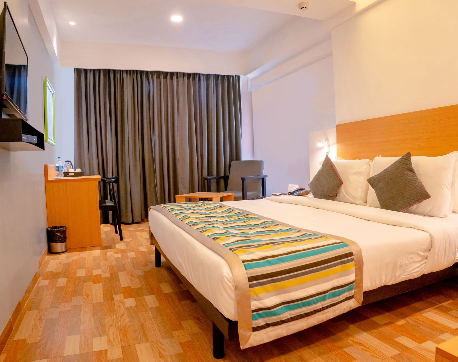 Ameya Room with a double bed and a television
