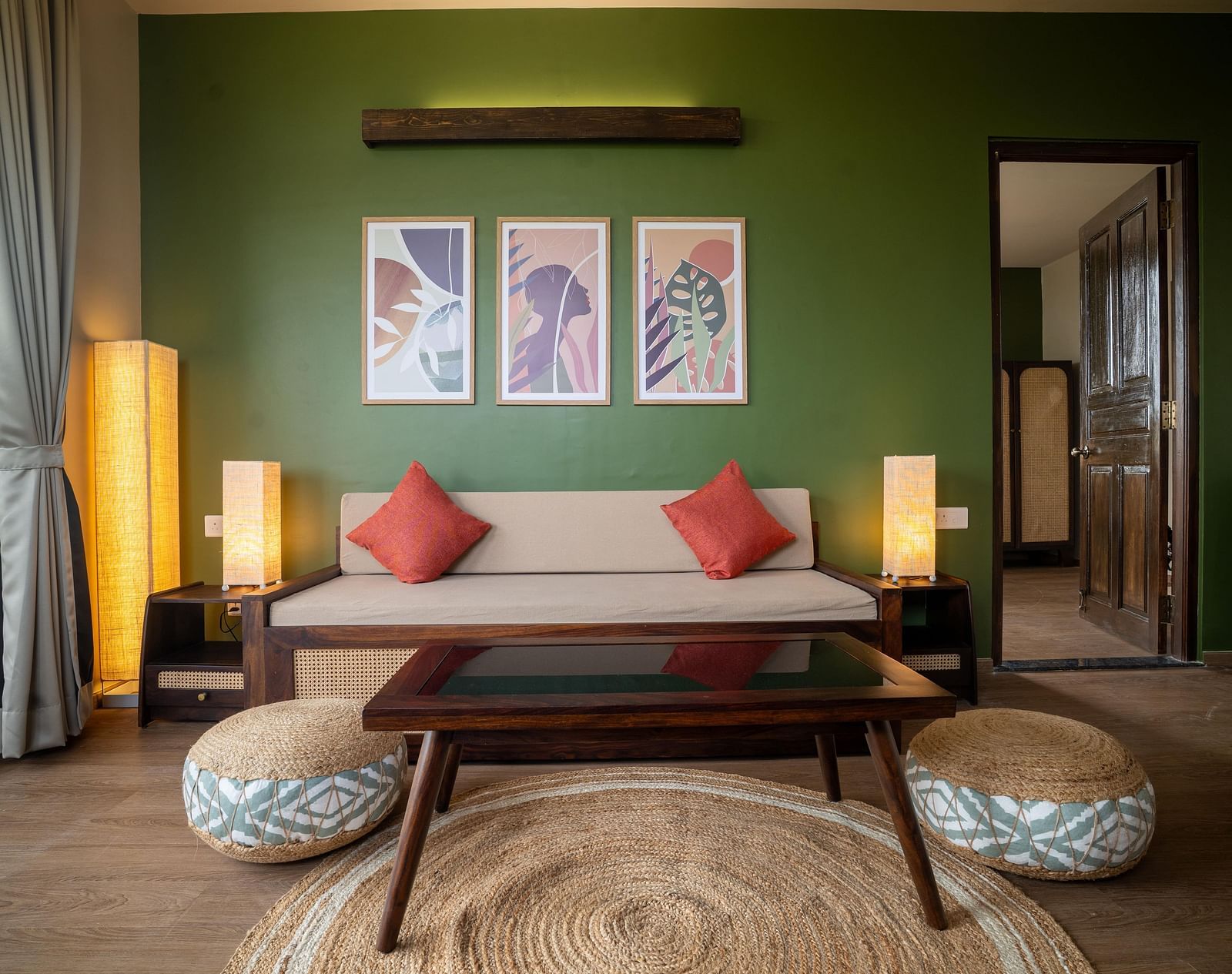 Chic living area with a wooden coffee table, pouffes, and contemporary wall art at Kssemya.