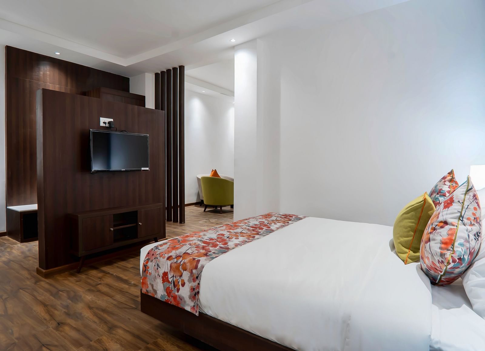 Family Room at Hotel Le ROI Lake View Koti with a sperated TV cabinet and a posh bed for a cosy stay4