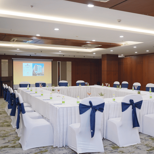 Conference room at Nemesia set up with tables and chairs for a boardroom meeting or small gathering.
