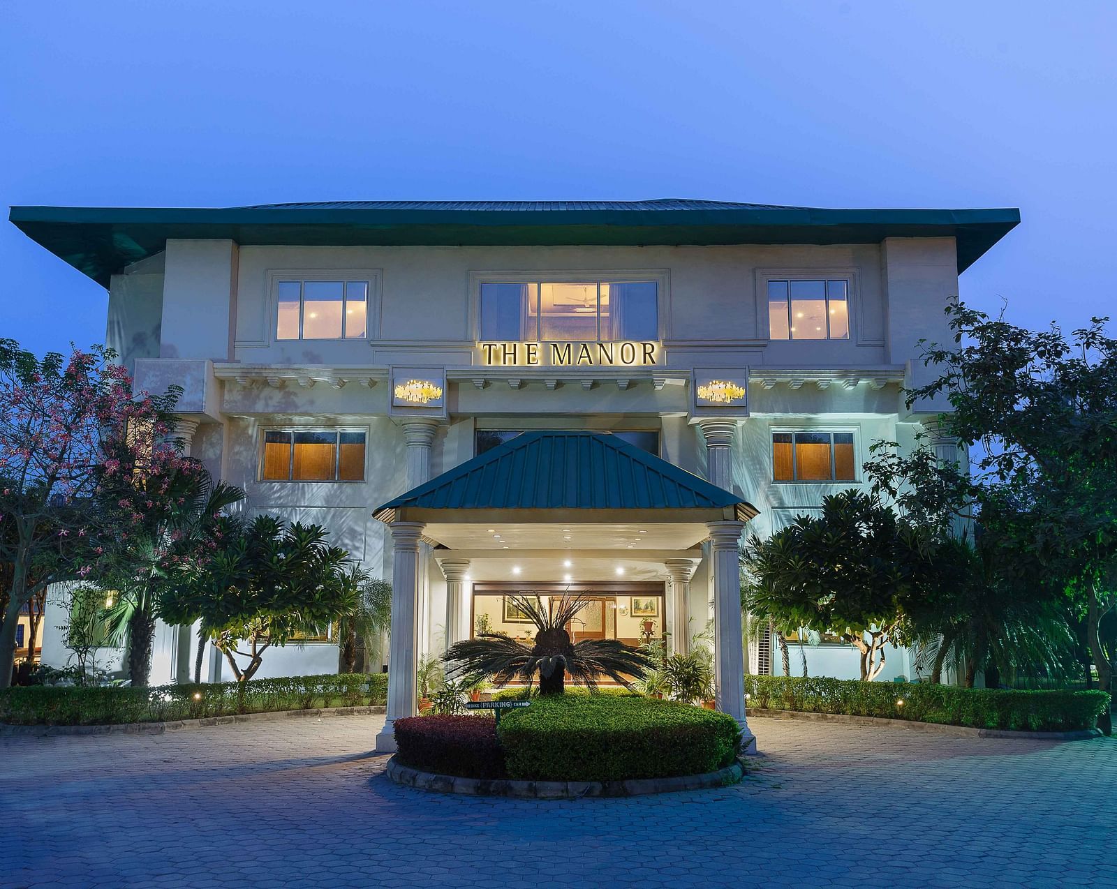 A wide view of the facade of the hotel taken from the front - The Manor, Kashipur