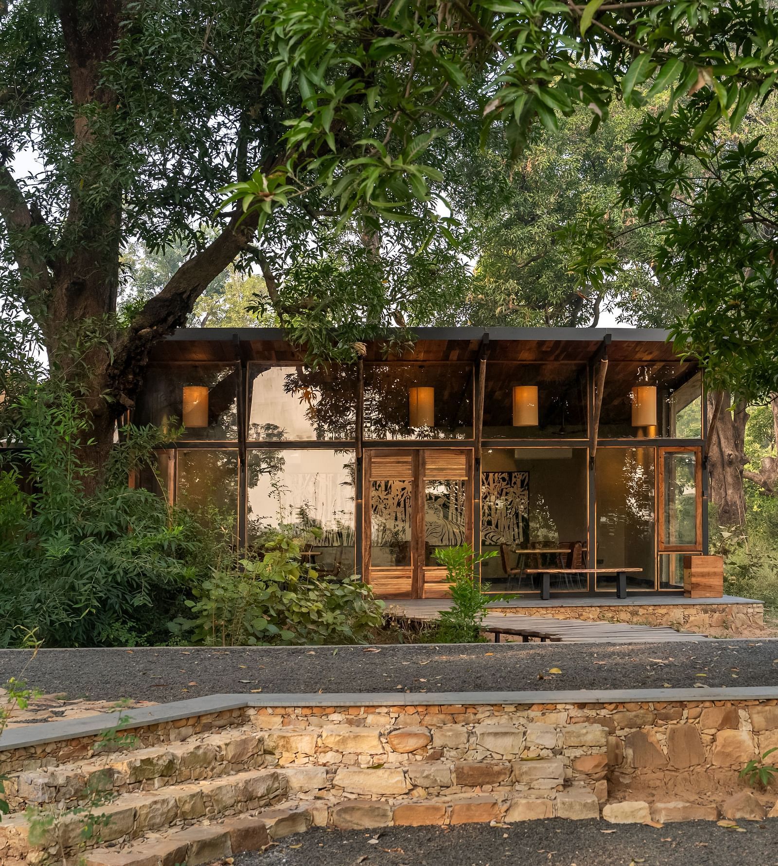View of a hut amongst greenery at Trees N Tigers, Tadoba.