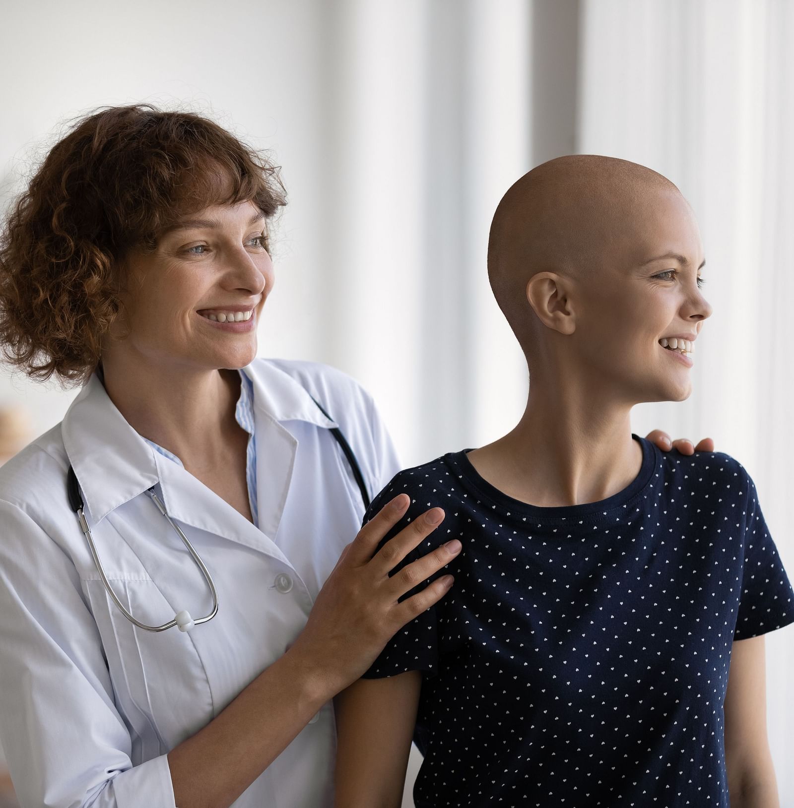 A woman receiving care from a nurse for Metastatic Disorder - Shreyas Retreat