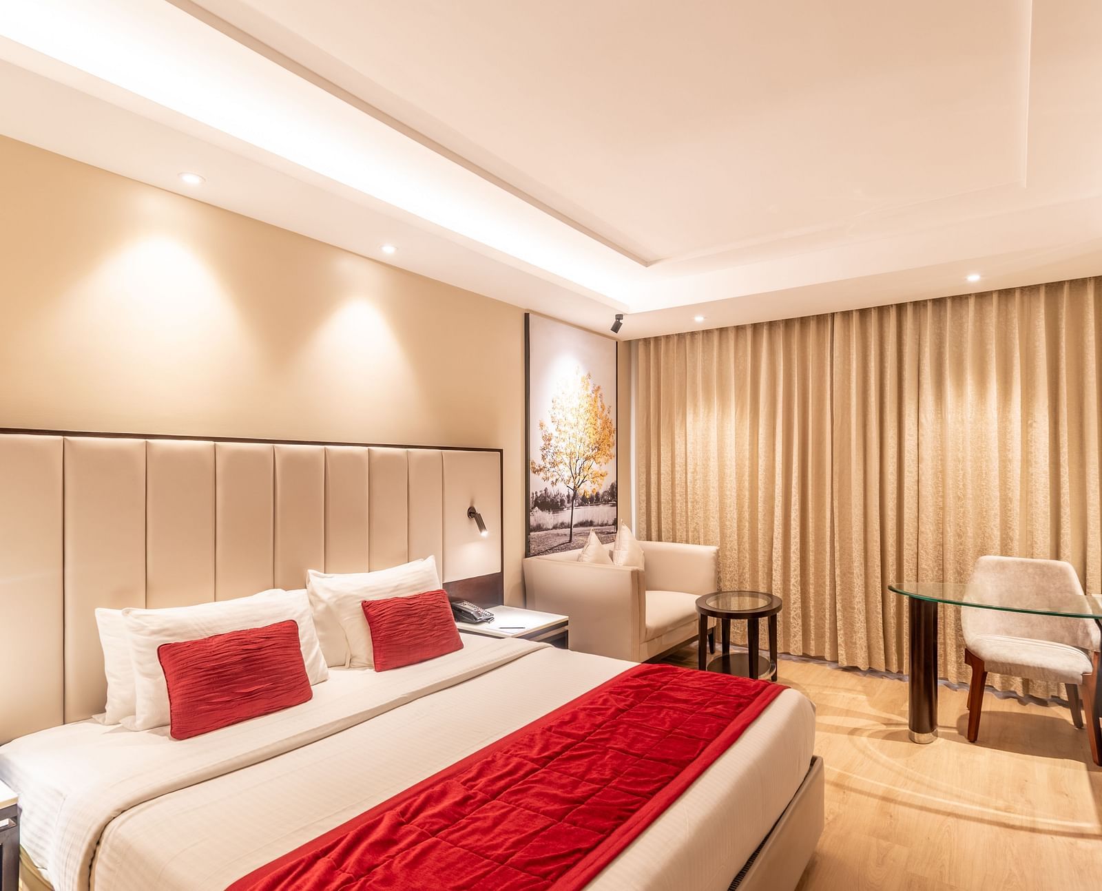 Spacious hotel room with double bed, work desk, and armchair - TGI Grand Fortuna, Krishnagiri Main Road, Hosur