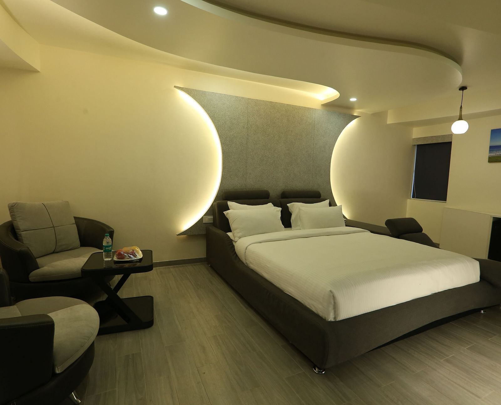 A view of Club Suite with a focus on the king size bed taken from near the entrance - TGI SPS Grand, Coimbatore