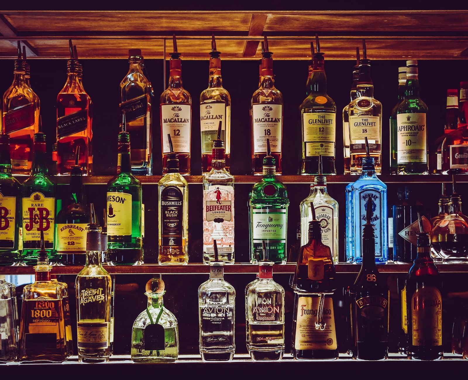 Assorted alcohol bottles placed on the counter.