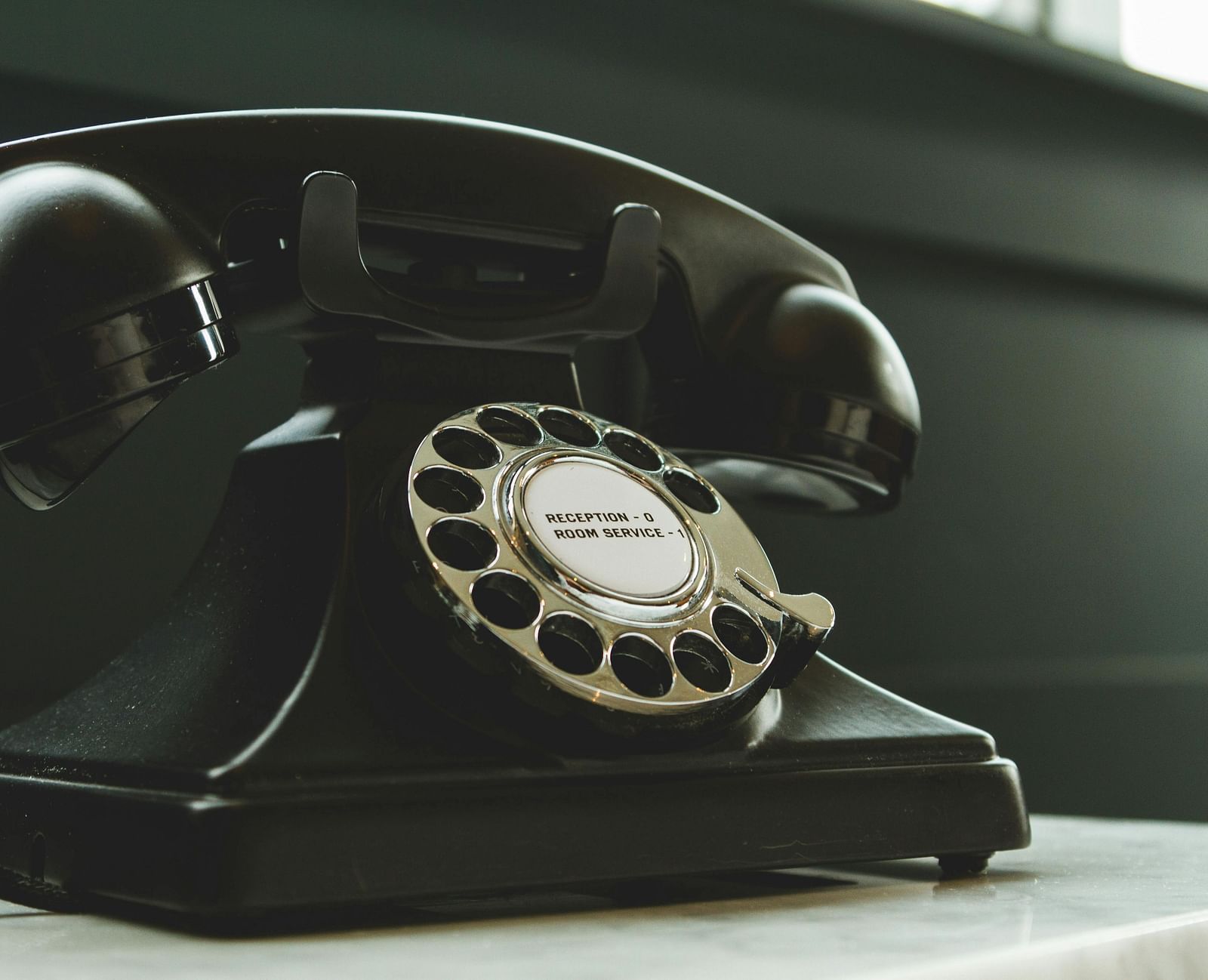A telephone placed on a counter.